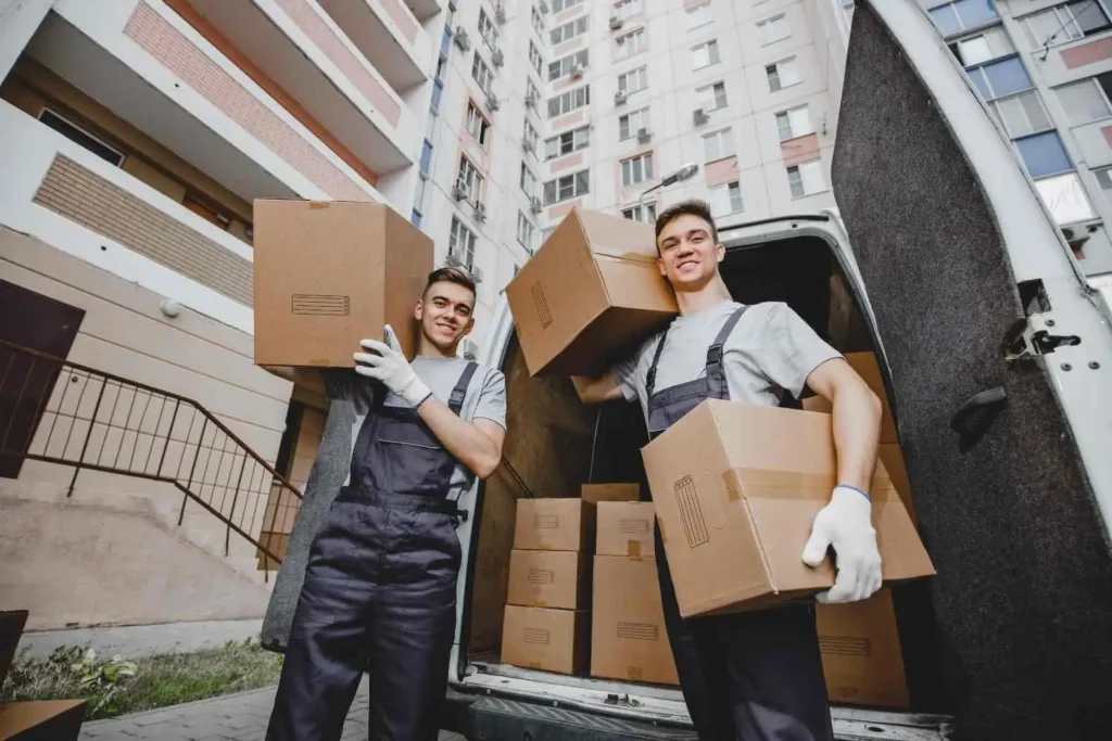 Crew from one of the best long distance movers in South Florida loading a dedicated truck at a condo tower