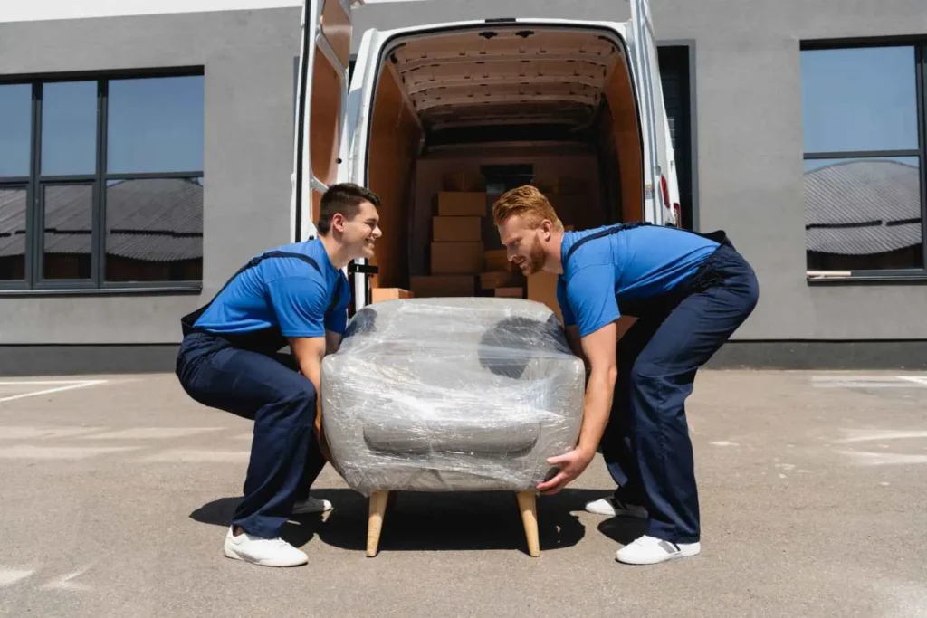 Intrastate movers loading furniture into a truck for an in-state Florida move