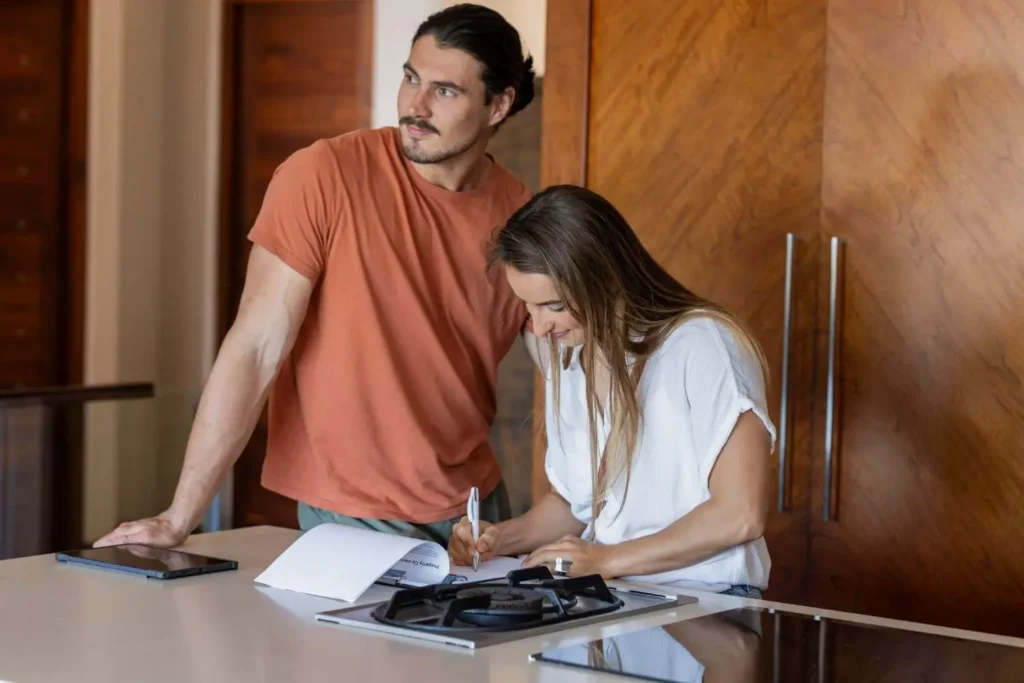 Homeowner reviewing an itemized South Florida moving quote with a moving consultant